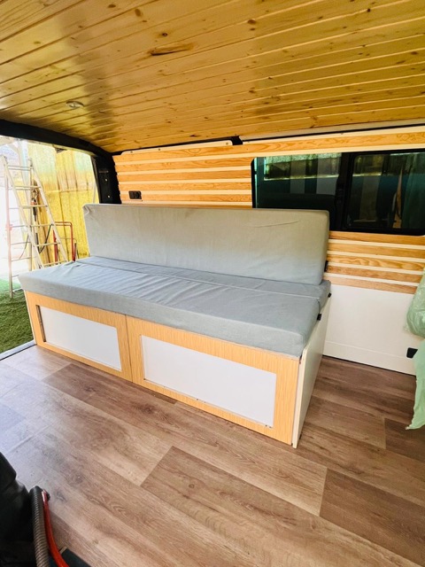 Volkswagen T6 camper conversion detail with custom cabinetry and clean design