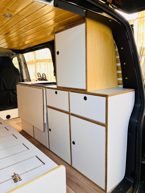 Fully equipped camper van kitchen setup inside Volkswagen T6 Andrómeda