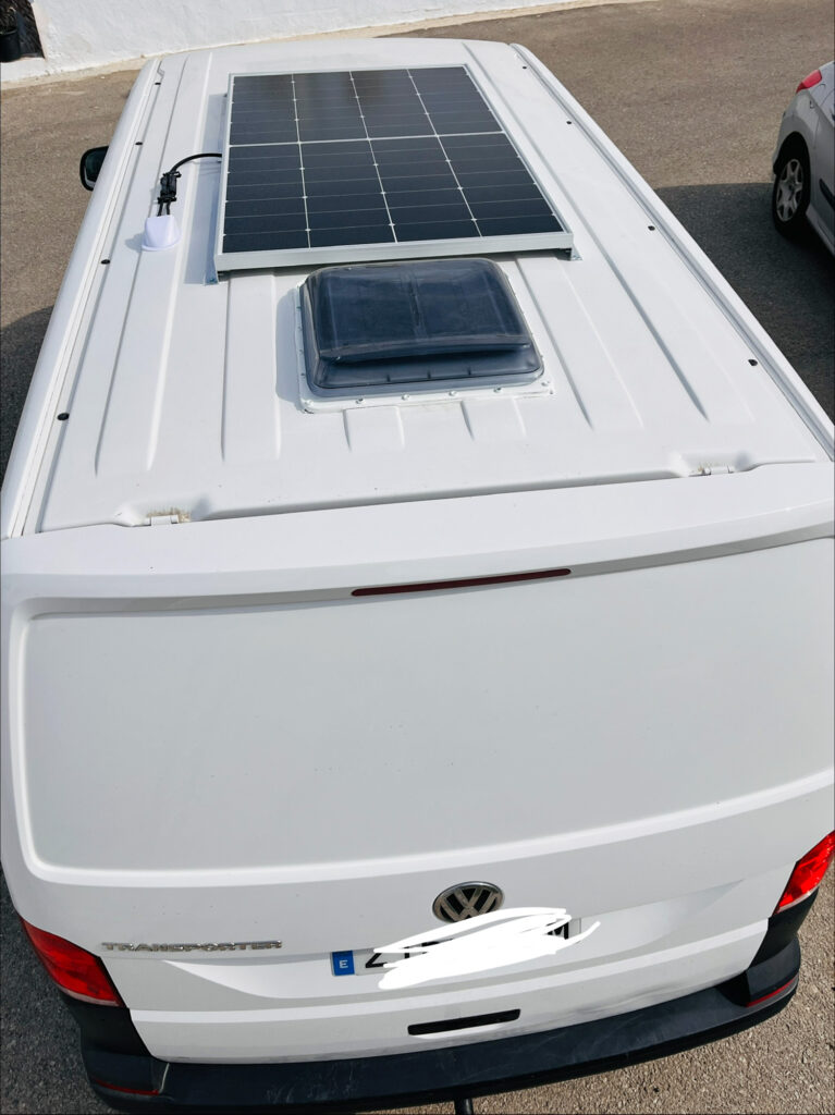 Custom camper van interior with plywood furniture and vinyl flooring